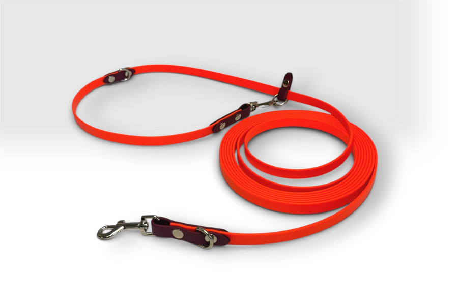 One-piece hands-free leash — safety orange with maroon accents, silver hardware