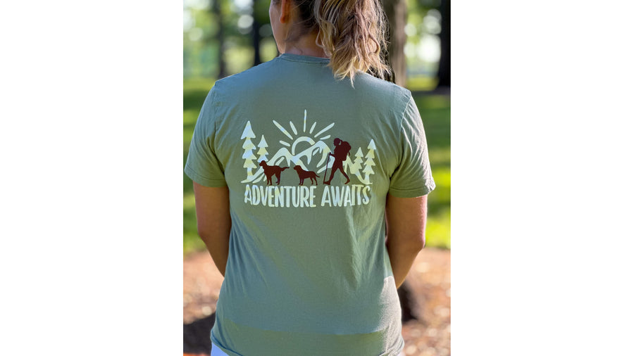 Shirt — Adventure Awaits design on the back of a sage green tee