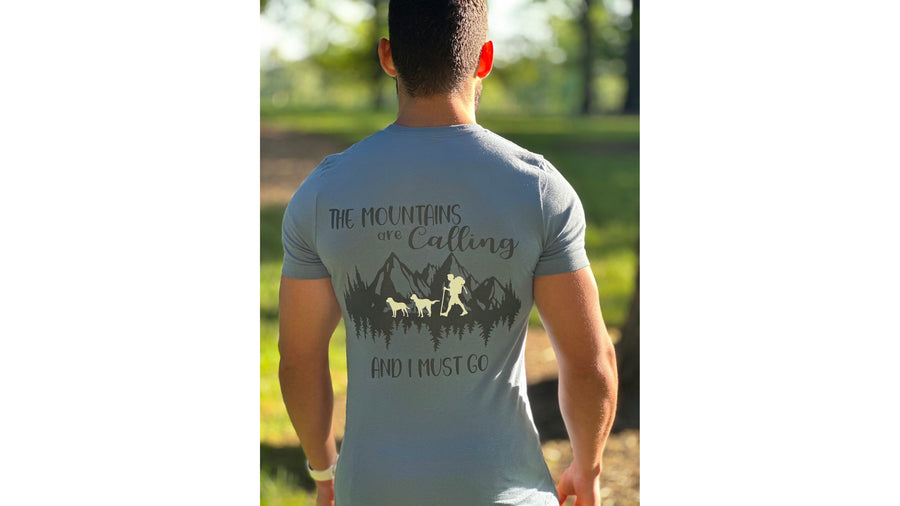 Shirt — The Mountains Are Calling design on the back of a slate blue tee